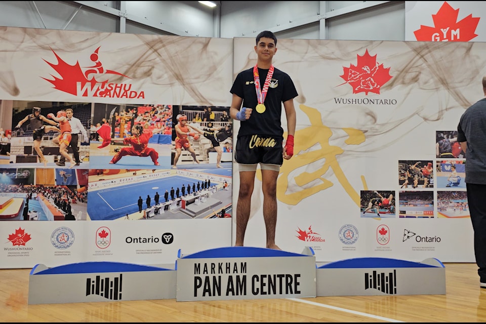 Akashdeep Dhesi, 16, on the podium with his gold medal.