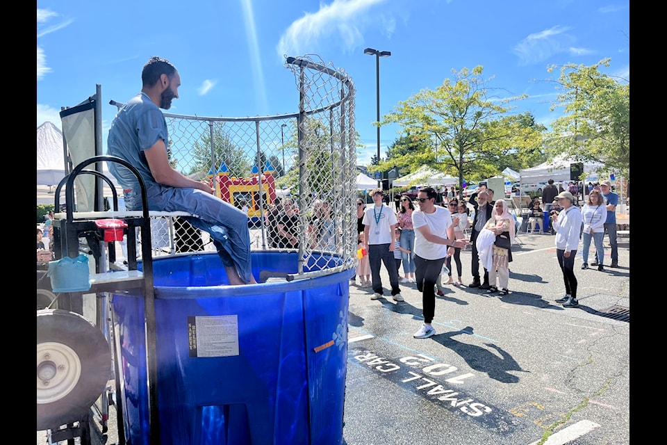 A freshly dunked Dr. Bippan Sangha just before he was dunked again at a 70th birthday celebration for Peace Arch Hospital in White Rock Sunday (Aug. 25). 
