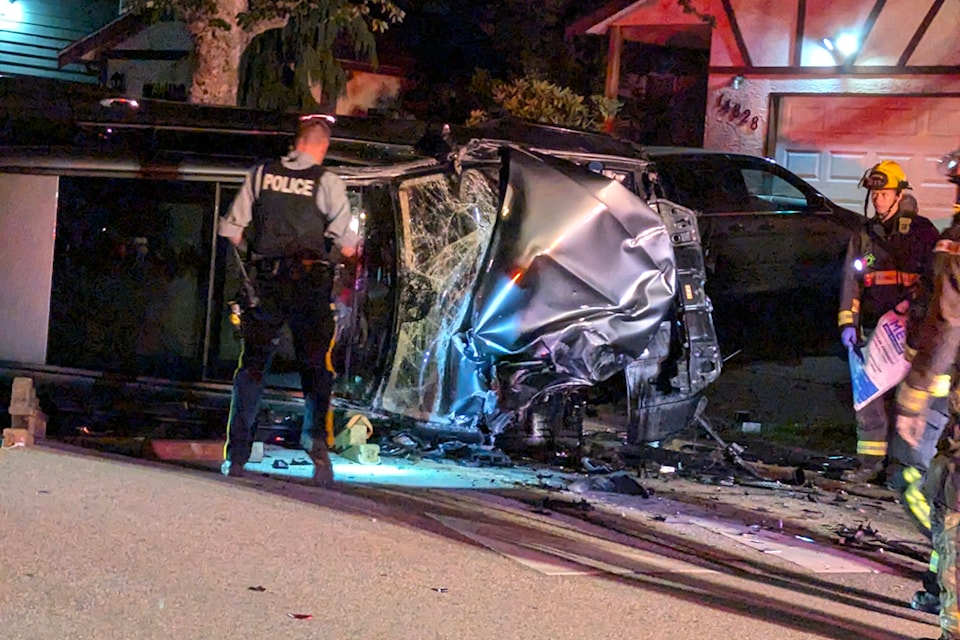 Police on scene at an accident in South Surrey in the early morning hours of Aug. 7, 2024. The driver of a vehicle reportedly ran a stop sign at 17 Avenue and 148 Street and struck a parked white van.