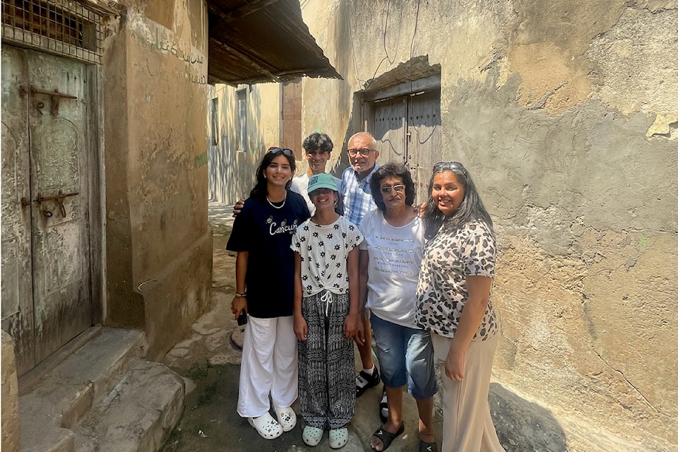 Taslim Jaffer (right) with her children Inaya, Aariz and Alyzeh, father Abdul Juma, cousin Nimet Juma visit Jaffer's father's first family home in Old Town Mombasa during a 2024 trip to Kenya.