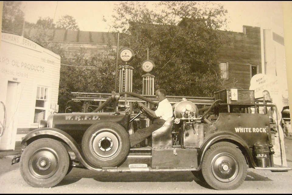  Then White Rock Fire Chief Jack Kelman with the truck in the early 1940s, at the time it lived at his Washington Avenue Shell service station.         