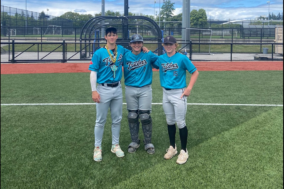 Pitchers Ben McKinnon, left, and Luke Thomas, far right, with catcher Vasya Seymour, pitched a combined no-hitter Sunday (June 23) vs. UBC.