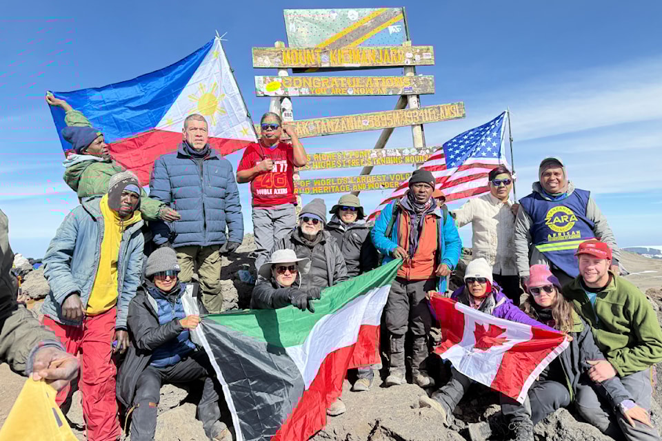 White Rock's Jhet van Ruyven proudly displays the Canadian flag at the summit of Mount Kilimanjaro on Oct. 8, 2024.