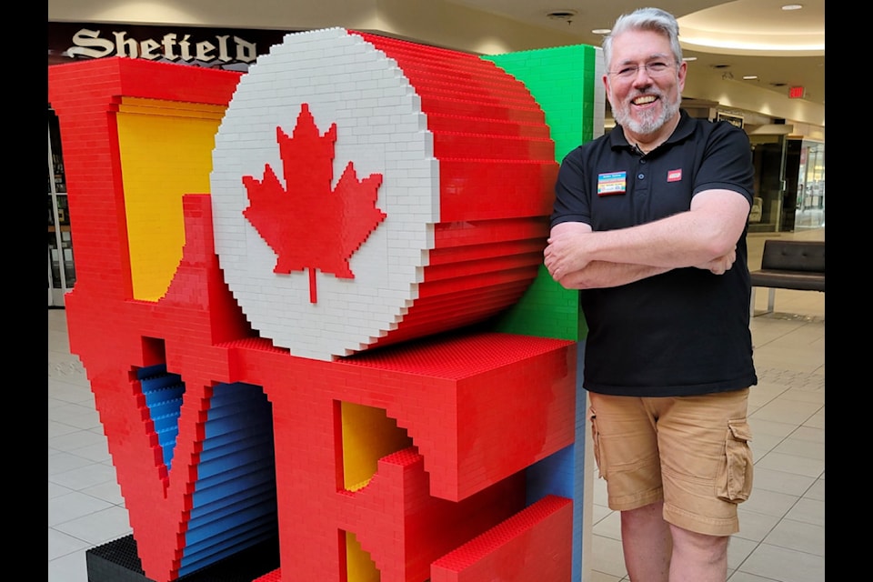 LEGO 'Brickmaster' Robin Sather was at Semiahmoo Shopping Centre March 28-30, 2025, recreating the 'LOVE' sculpture as part of a 11,000-piece 'Canadian Love' display.