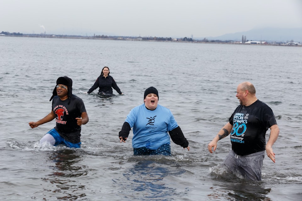 Surrey RCMP officers, firefighters and athletes participated in the Polar Plunge for Special Olympics BC in Crescent Beach in 2023. 