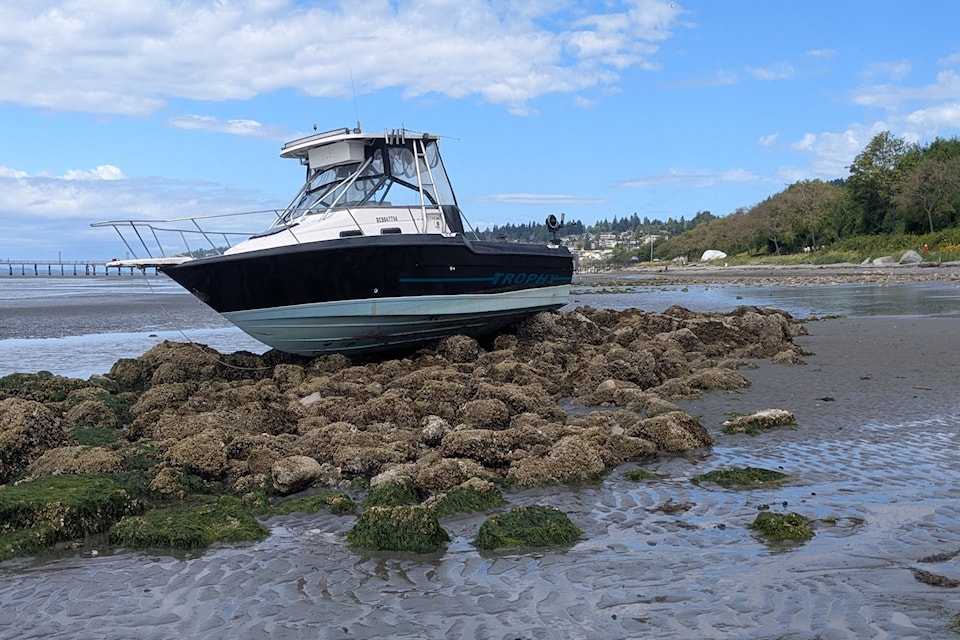 A boat washed ashore in White Rock along East Beach, as seen on Monday, July 14, 2025.