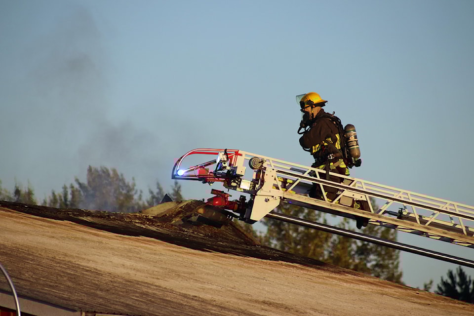 Surrey firefighters battle a blaze at a used car dealership on Fraser Highway Tuesday evening (July 15).