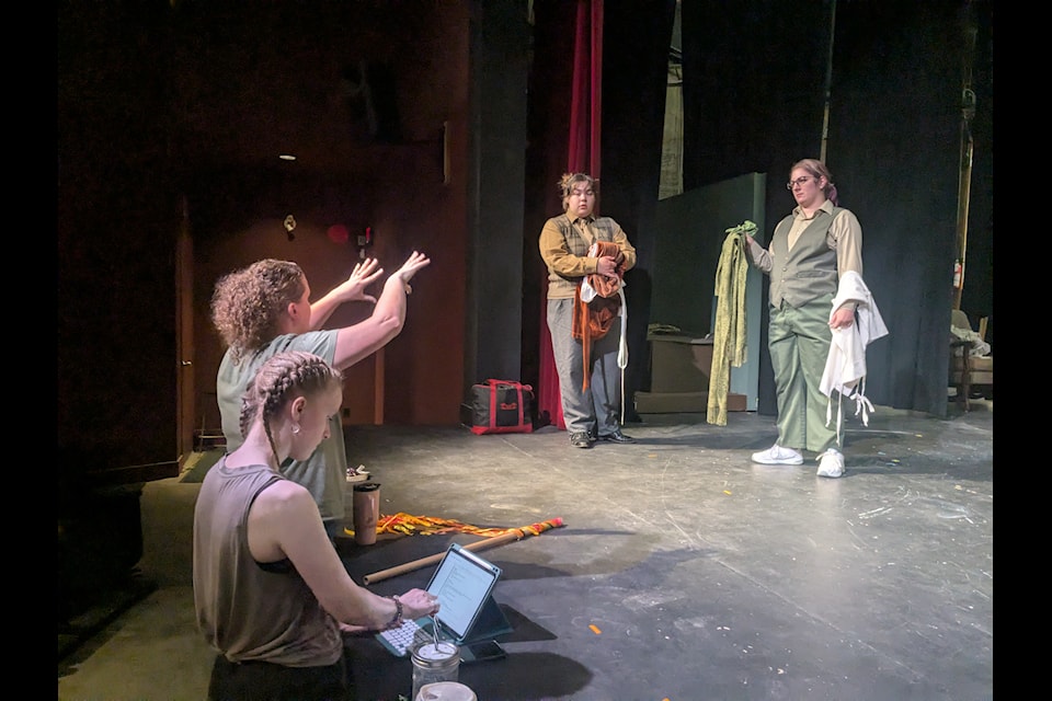Director Becky MacDormand talks costumes to Cath de la Rambelje (Toad) and Amanda Russell (Frog) while stage manager Grace Moore takes notes during a rehearsal of the upcoming musical A Year With Frog and Toad at Oceana PARC Playhouse.