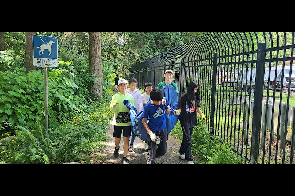 Students from H.T Thrift Elementary and Semiahmoo Secondary helped the Green Team tackle invasive species at Ruth Johnson Park in White Rock Tuesday (June 10).