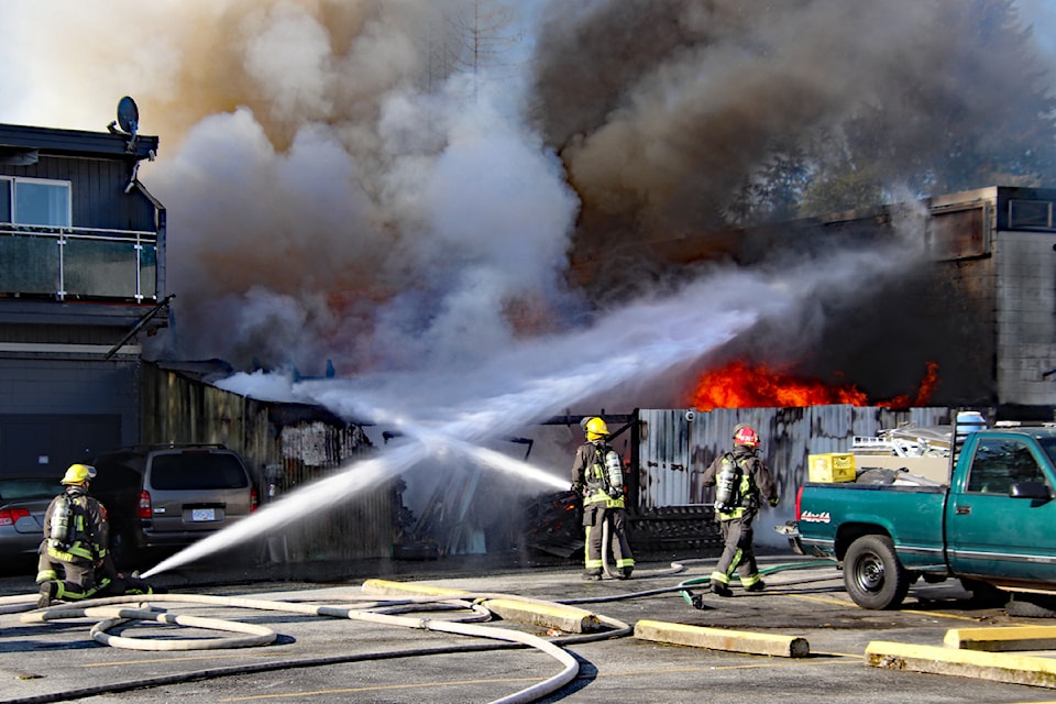 Surrey firefighters battle flames and heavy smoke at a commercial structure in the 13300-block of 71A Avenue Sunday morning (May 4).