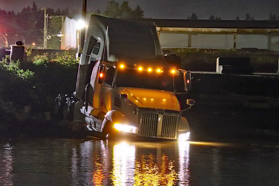 A suspect has been taken into custody after police from several agencies pursued the driver of a semi truck from Langley through Surrey early Thursday morning (May 15). The truck ended up in the Fraser River in Surrey. 