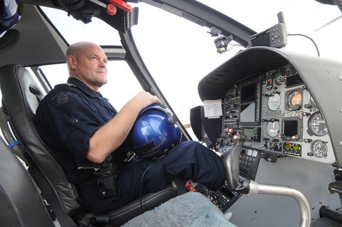 Air 1 RCMP Tactical Flight officer Cpl. Curtis Brassington inside the cockpit