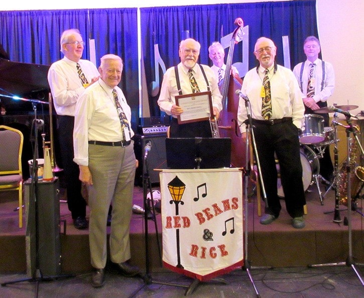Rice Honeywell (centre) was  presented with a plaque honouring his contributions to music at the 2015 Jazz Band Ball. (File photo)