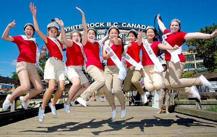 A flock of White Rock Youth Ambassadors in mid air.