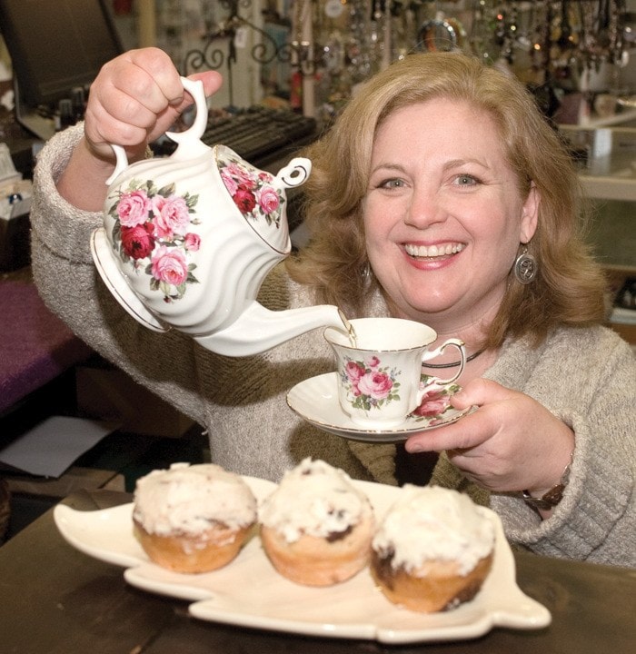 Maureen Coroliuc of Angelic Tea Pot with tea and Cinamon buns.