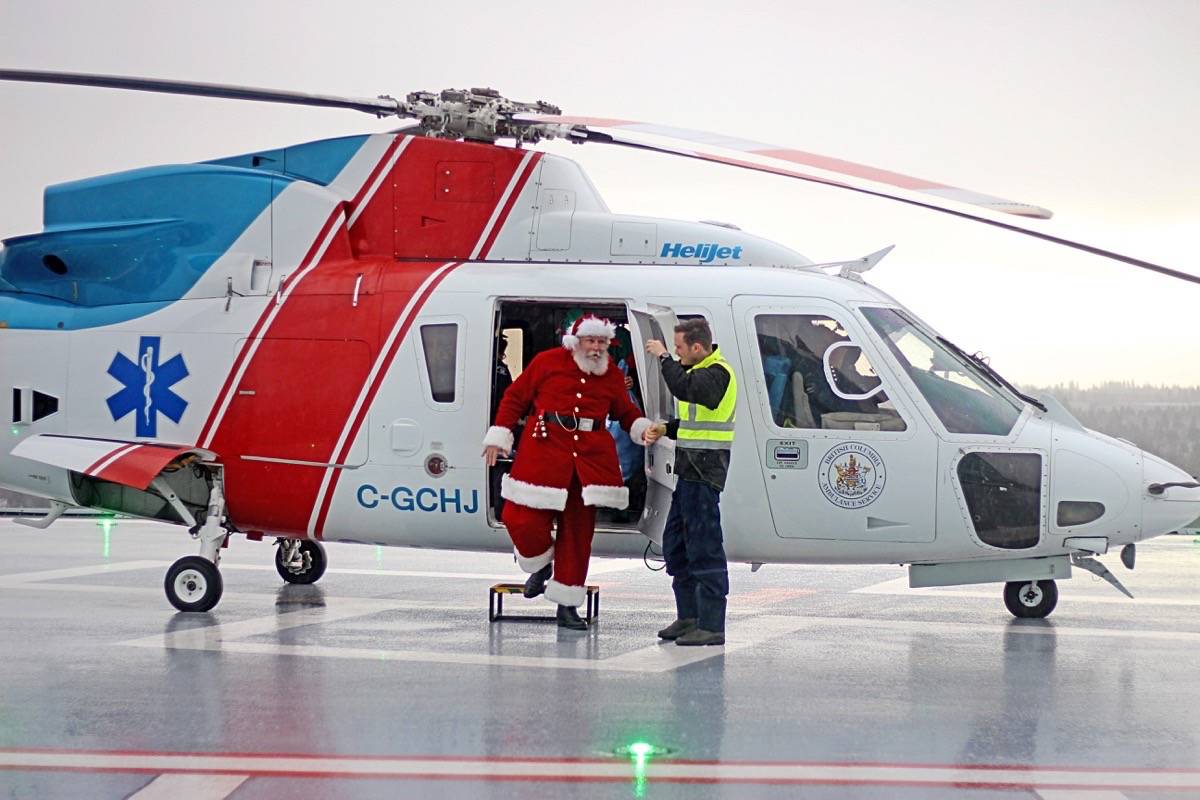 14855928_web1_181218-SNW-M-SurreyMemorial-SantaHelicopter2-lc-dec12