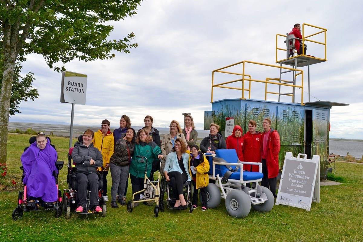 17755403_web1_190718-PAN-M-beach-wheelchair-group