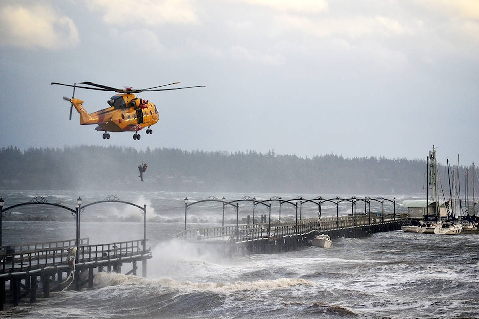 A man is rescued from the White Rock Pier after a violent windstorm contributed to destroying the mid-section of the structure Dec. 20, 2018. (Aaron Hinks file photo)