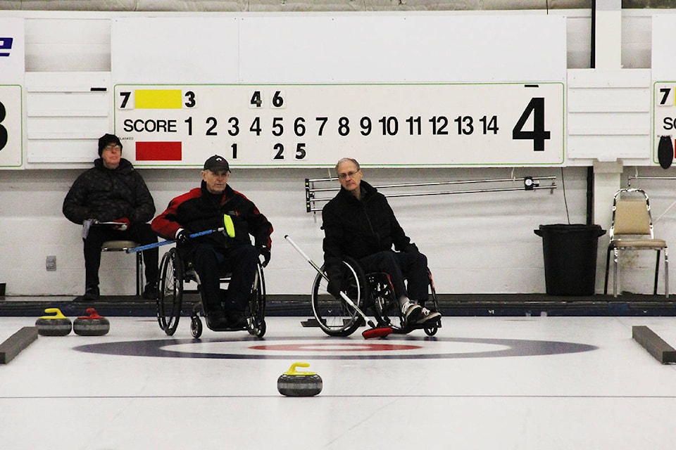 Skip Darryl Neighbour (left) plays against skip Bob Macdonald during the wheelchair curling provincial championships at Cloverdale Curling Club Feb. 1 (Photo: Malin Jordan)