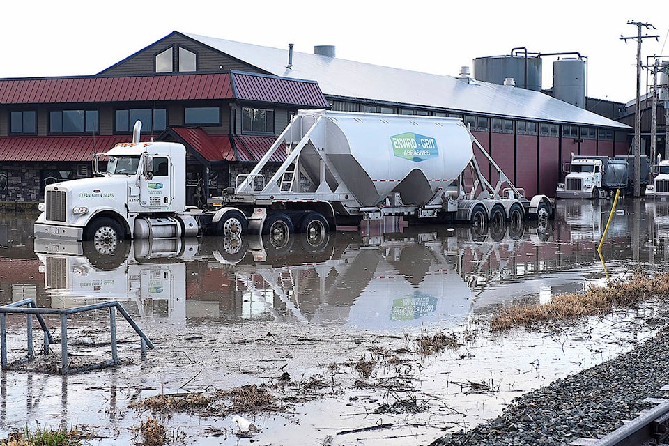 A truck sits in flood water at a business park on the Canadian side of the Sumas border crossing in Abbotsford on Sunday, Feb. 2, 2020. (John Morrow)