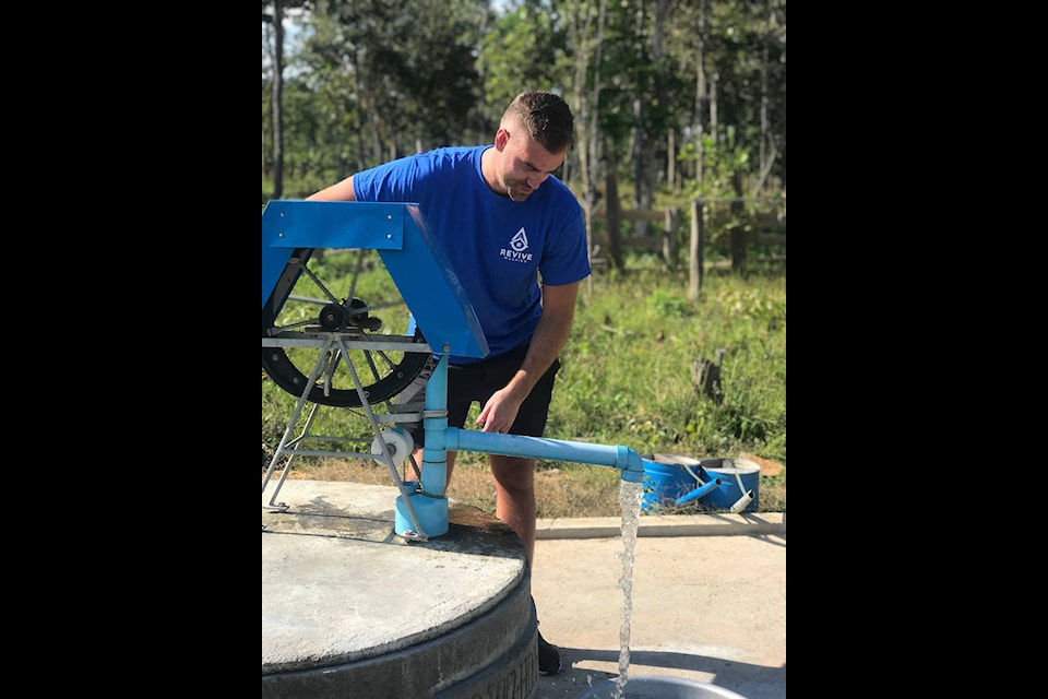 David Moerman pumps water out of a well in Pursat, Cambodia in December, 2019. Moerman’s company, Revive Washing, funded the water well. (Photo: Submitted)