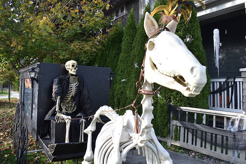 While the number of houses decorated for Halloween seem to be down compared to previous years, some homeowners kept the tradition alive, sort of. In South Surrey’s Summerfield neighbourhood, a skeleton horse and buggy are the showcase displays. The decorations include levitating candles, tomb stones, and skeleton dogs. (Aaron Hinks photo)