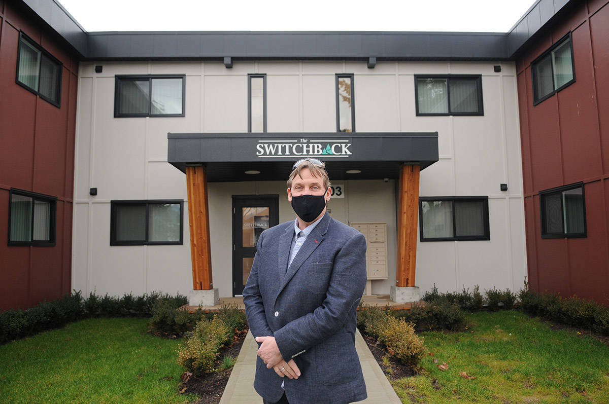 Les Talvio stand outside The Switchback, a supportive housing building for youth on Dec. 18, 2020. (Jenna Hauck/ Chilliwack Progress)