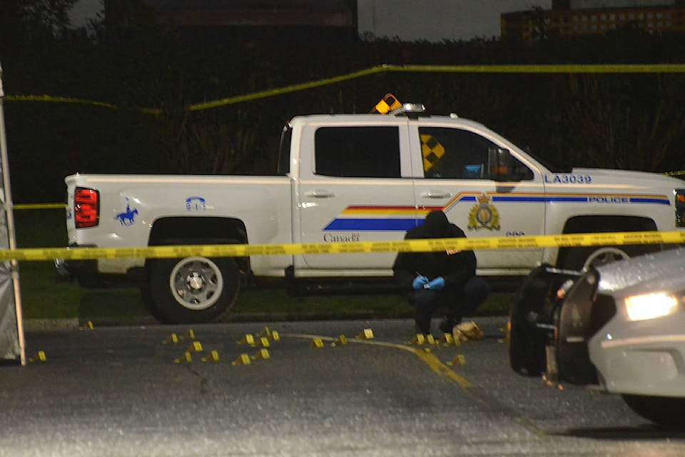 Investigators placed dozens of yellow evidence markers on the ground near the site of a fatal shooting in Langley City early Wednesday morning. (Matthew Claxton/Langley Advance Times)