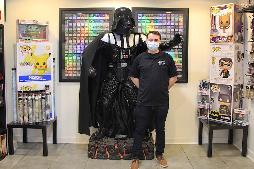 Store worker Simon Wright poses with Darth Vader at Cloverdale’s House of Cards on May the 4th. (Photo: Malin Jordan)