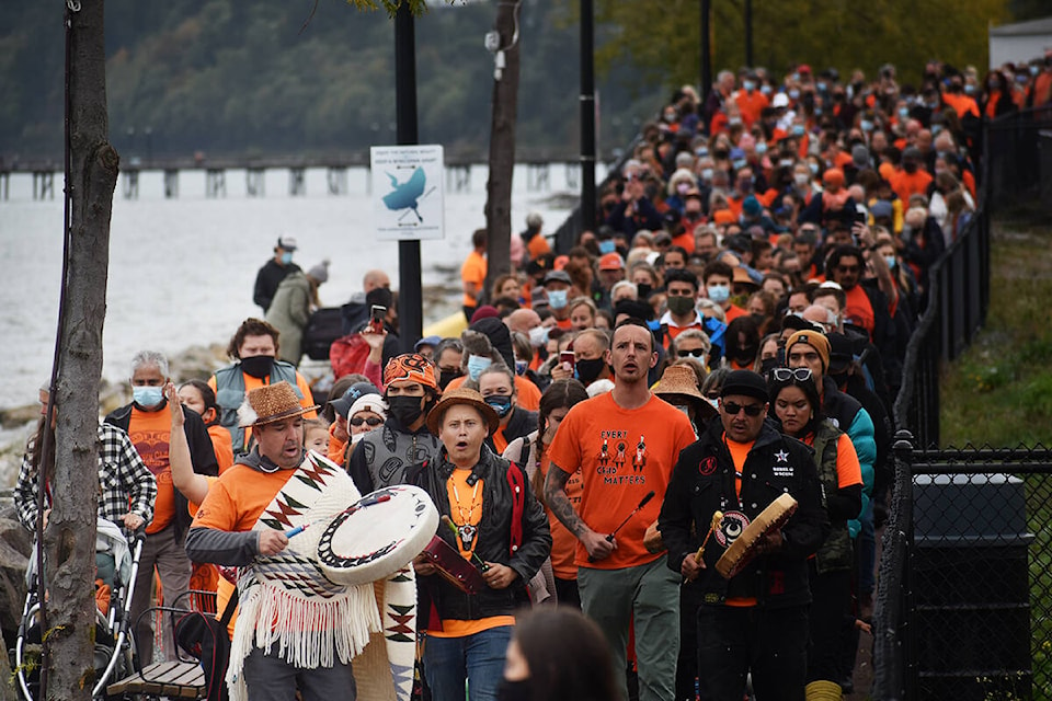 Thousands of people follow residential school survivors, Indigenous leaders, elders and youth on a walk to Semiahmoo First Nation lands during National Day for Truth and Reconciliation. (Aaron Hinks photo)