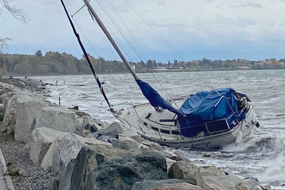 A U.S. sailboat crashes up against the shore of White Rock beach after running aground. The boat came unattached and floated into Canadian waters as a result of the heavy winds that battered the west coast from Vancouver Island to California Monday. (Brenda Anderson photo)