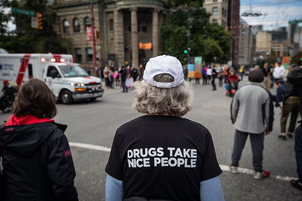 Paramedics respond to a call as Vancouver city councillor Jean Swanson attends a march to remember those who died during the overdose crisis and to call for a safe supply of illicit drugs on International Overdose Awareness Day, in Vancouver, on Tuesday, August 31, 2021. THE CANADIAN PRESS/Darryl Dyck