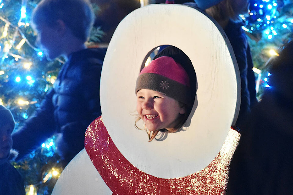 Sadie Chapin, 4, smiles for a photograph at White Rock’s Bright Walk Sunday evening. (Aaron Hinks photo)