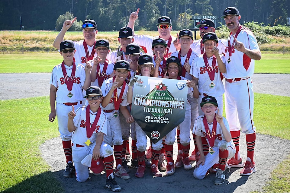 Cloverdale’s U11 AAA Tier 1 Spurs hold up their gold medals and provincial champion banner after their walk-off championship win July 31. The Spurs defeated White Rock in the final 10-9. Over the course of their six-week summer season, the kids went 27-3. (Photo submitted: Scott Paterson)