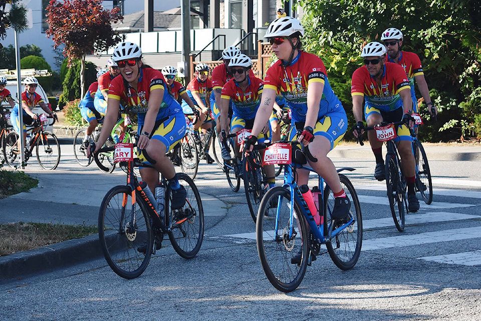 Cops for Cancer’s Tour de Valley team rode through White Rock, making a stop at Peace Arch Elementary where they were met with cheering students. (Sobia Moman photo)
