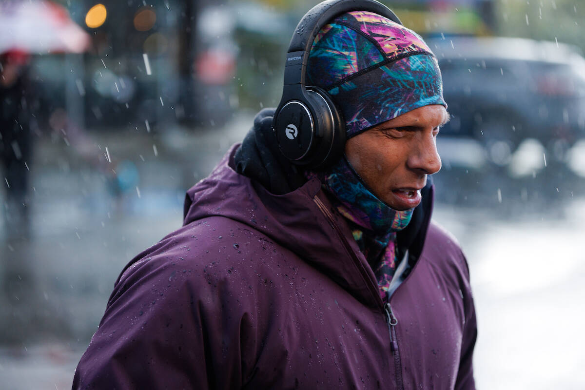 Surrey resident Sachin Latti runs in heavy rain Nov. 6 during a day-long trek on roads from Chilliwack to New Westminster as part of his fundraising efforts for PTSD- and mental health-related initiatives. (Submitted photo: Jacob Fraser/fpsmediaproductions.com)