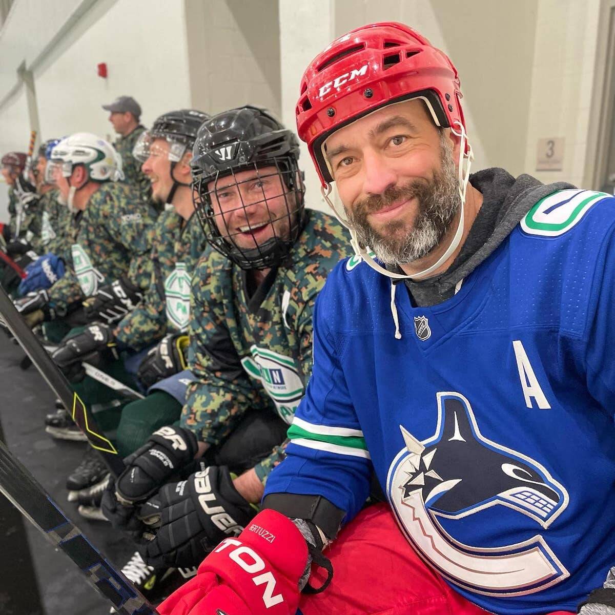 Former Vancouver Canucks forward Todd Bertuzzi, right, on the bench with Canucks Autism Network Pro-Am tournament participants at North Surrey Sport & Ice Complex last weekend. (Photo: Facebook.com/CanucksAutismNetwork)