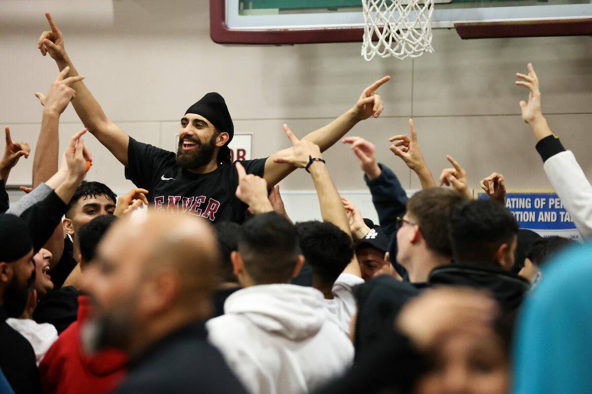 Ajaypal Hayer celebrates after scoring a three-pointer that won the Cougars the tournament. (Photo: Anna Burns)