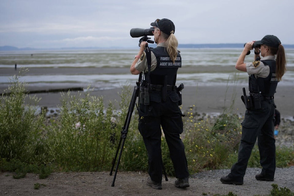 Fisheries and Oceans Canada officers, shown here in an undated photo taken at Crescent Beach, were working with the Canadian Coast Guard last week to crack down on illegal crab traps in Boundary Bay. Officers seized 270 trap during the five-day operation. (Geoff Yue photo)