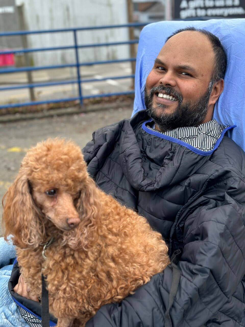 Kris Mallisetty, seen here with poodle Erica, was paralyzed from the neck down during surgery on his spine on Jan. 27. Because he doesnt qualify for Persons With Disability funding, a friend has set up a fundraiser to help pay for the costs of making his home wheelchair-accessible. (Leah Gray photo)