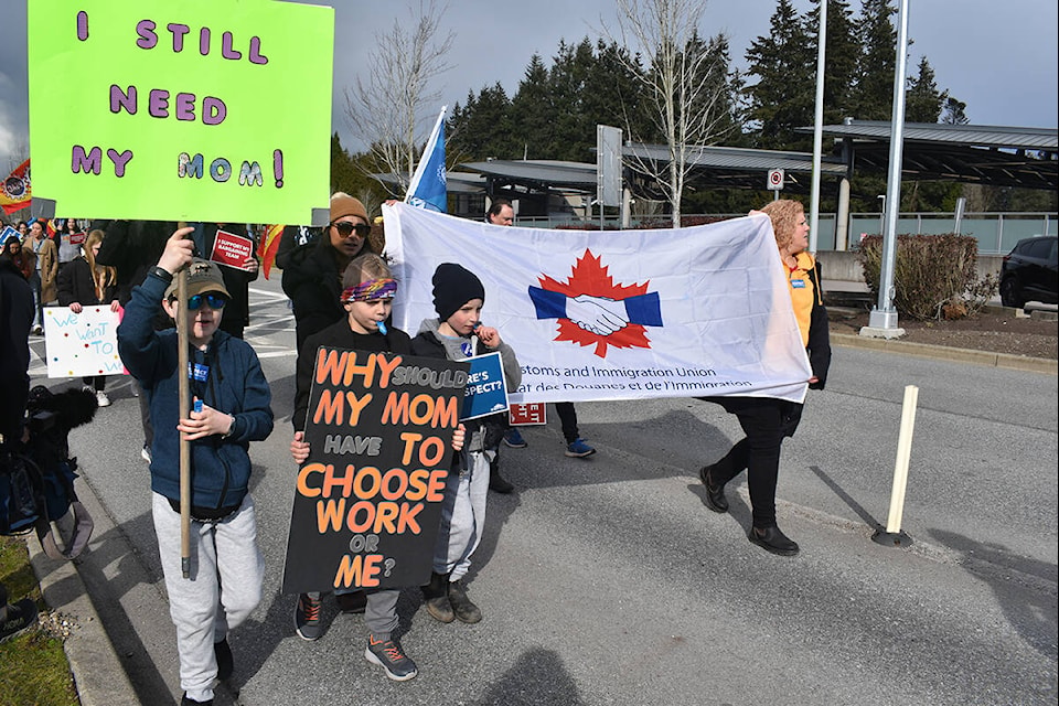 Protesters rallied at Peace Arch Provincial Park on Wednesday (March 8) afternoon, on International Women’s Day to send a message to CBSA. Part-time employees are reportedly being reverted back to full-time schedules, which many Canada border officers are saying will affect women employees, who have family obligations. (Sobia Moman photo)