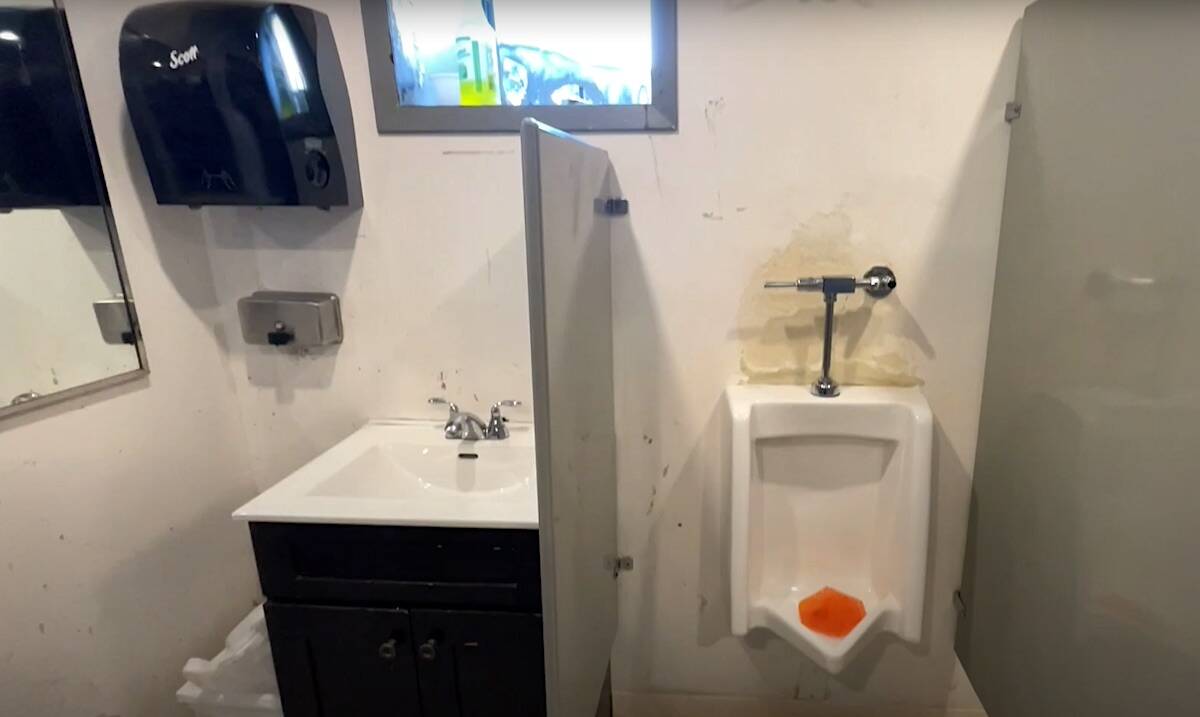 The mens bathroom at The Cove transitional shelter in Whalley, as seen in a video about a planned renovation project led by Victoria-based charity Herowork. (Youtube.com)