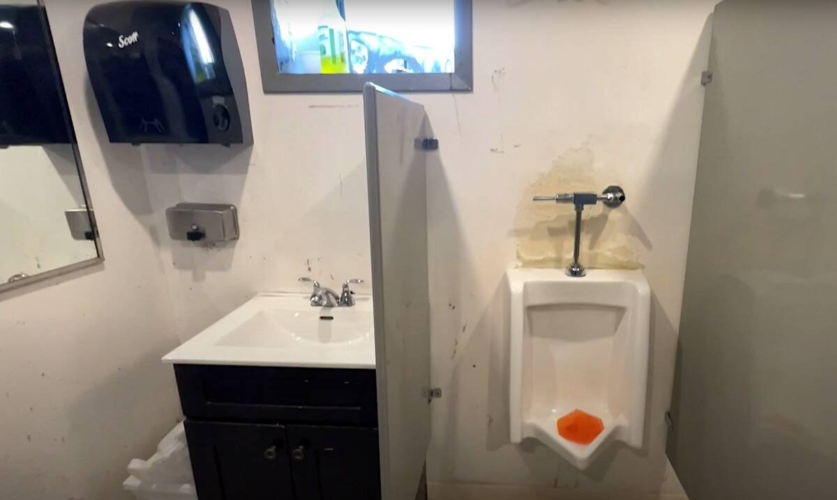 The mens bathroom at The Cove transitional shelter in Whalley, as seen in a video about a planned renovation project led by Victoria-based charity Herowork. (Youtube.com)