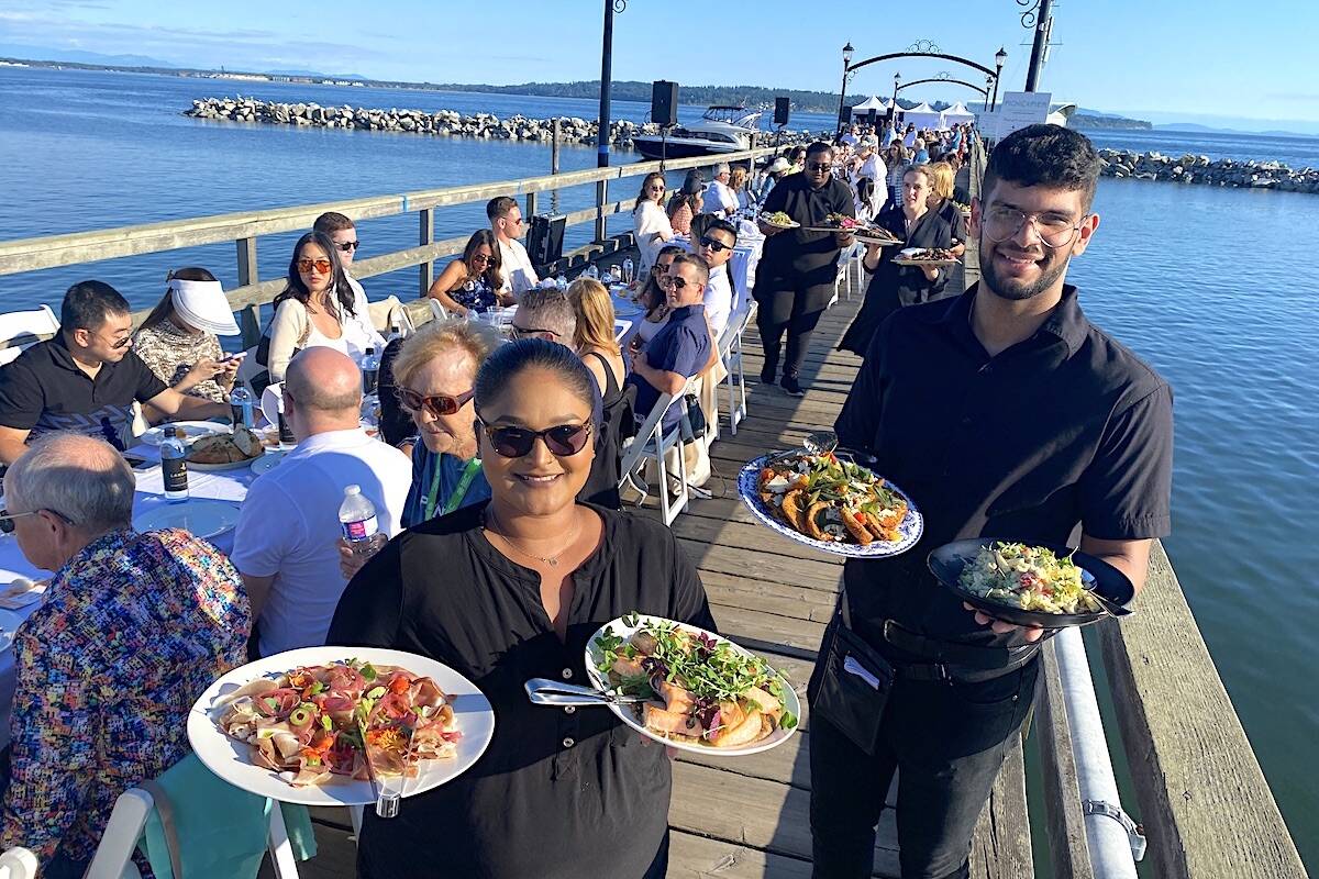 Servers with Blank Canvas Catering at the Picnic on the Pier event Thursday, Aug. 10, 2023 in White Rock. (Photo: Tom Zillich)