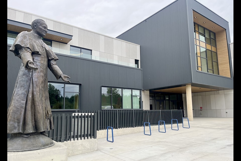 A statue of St. John Paul II with the words 'Be not afraid' greets visitors to the new Catholic high school on 182 Street in South Surrey.