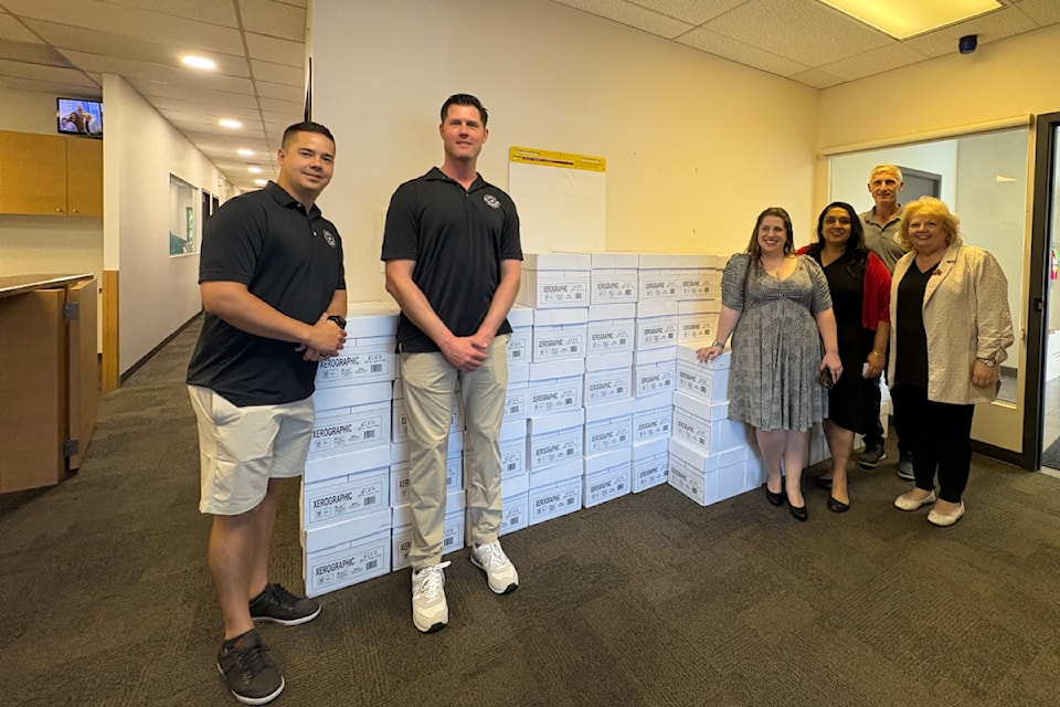 paper-donation-to-sta-locke-fire-fighters