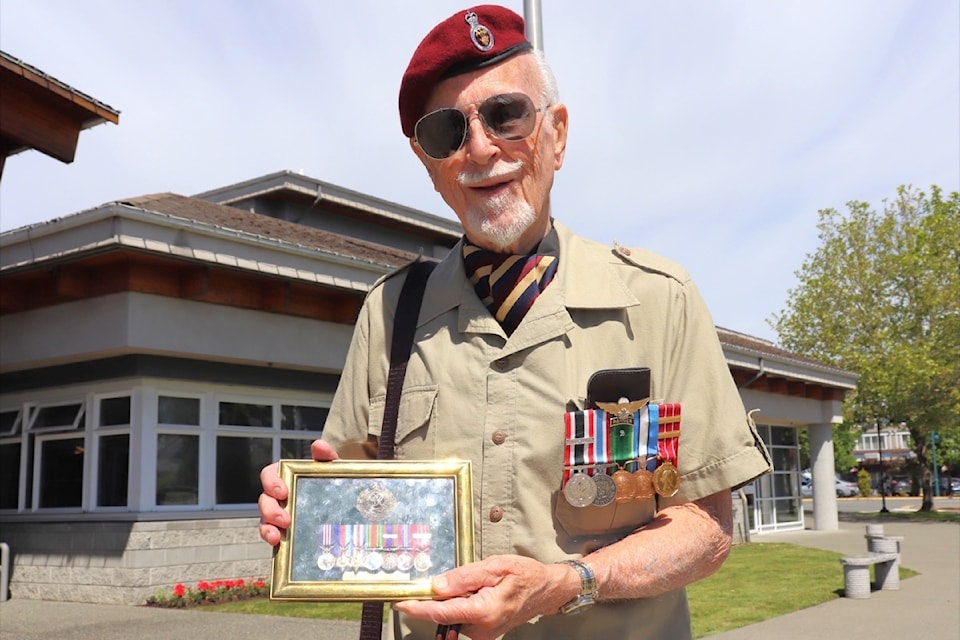 Stephan Brodsky displays medals his brother earned on D-Day, during a Sidney event on June 6, 2024. (Photo by Tim Collins)