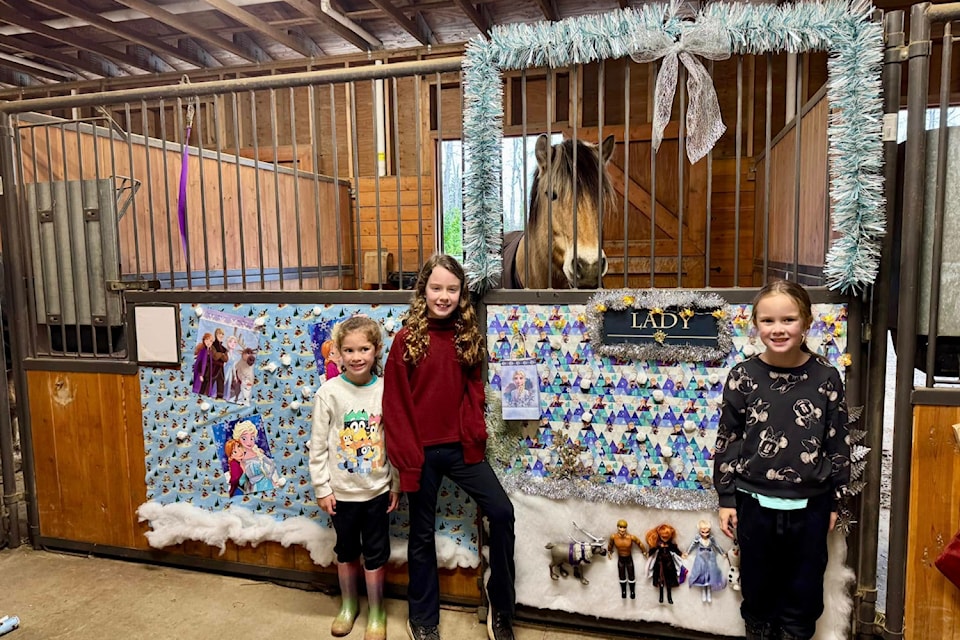 Victoria Therapeutic Riding Association volunteers get preparations in place for last year's Deck the Stalls event.