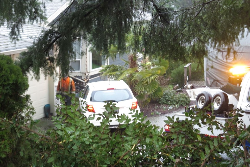A small white car barrelled down the 7-foot driveway and hitting the house's front bay window.