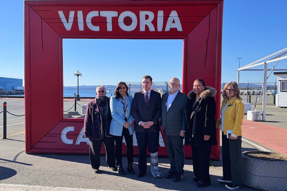 Victoria Mayor Marianne Alto (from left), federal Transport Minister Anita Anand, GVHA board chair Mark Mawhinney, Ron McKinnon,  Coquitlam-Port Coquitlam MP, Cecilia Dick, cultural tourism supervisor for the Songhees Nation, and Colleen Turner, vice-president of strategic partnerships and innovation at GVHA, stand at the gateway to Odgen Point.